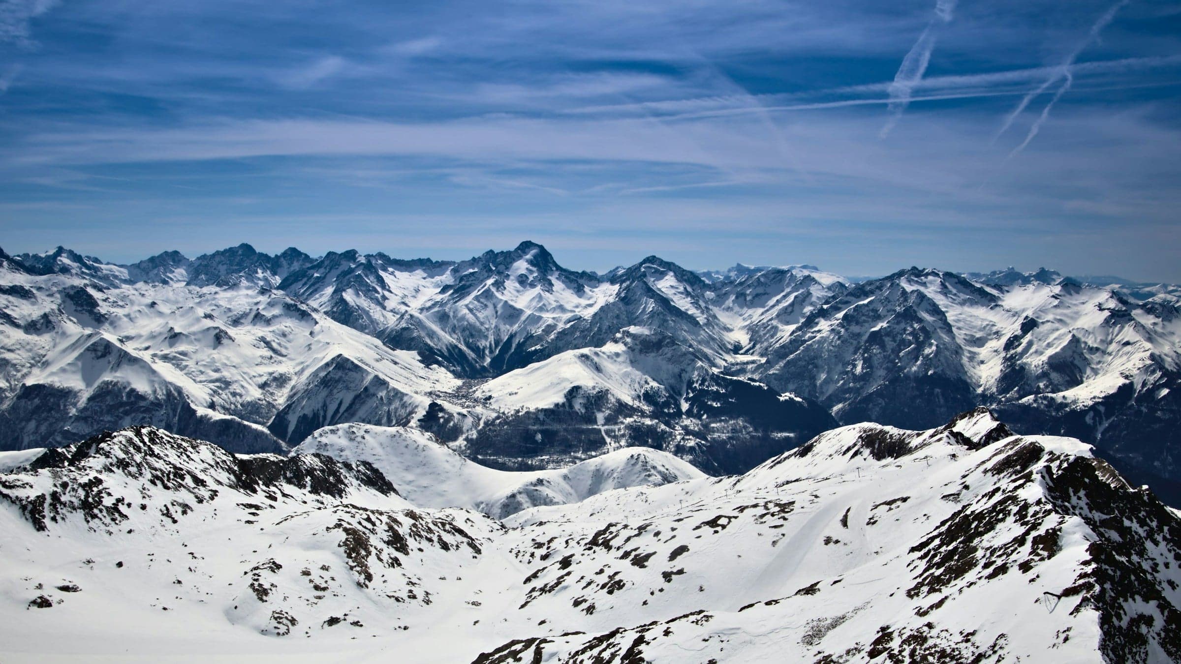 Aerial view of snow-covered mountains above Alpe d'Huez