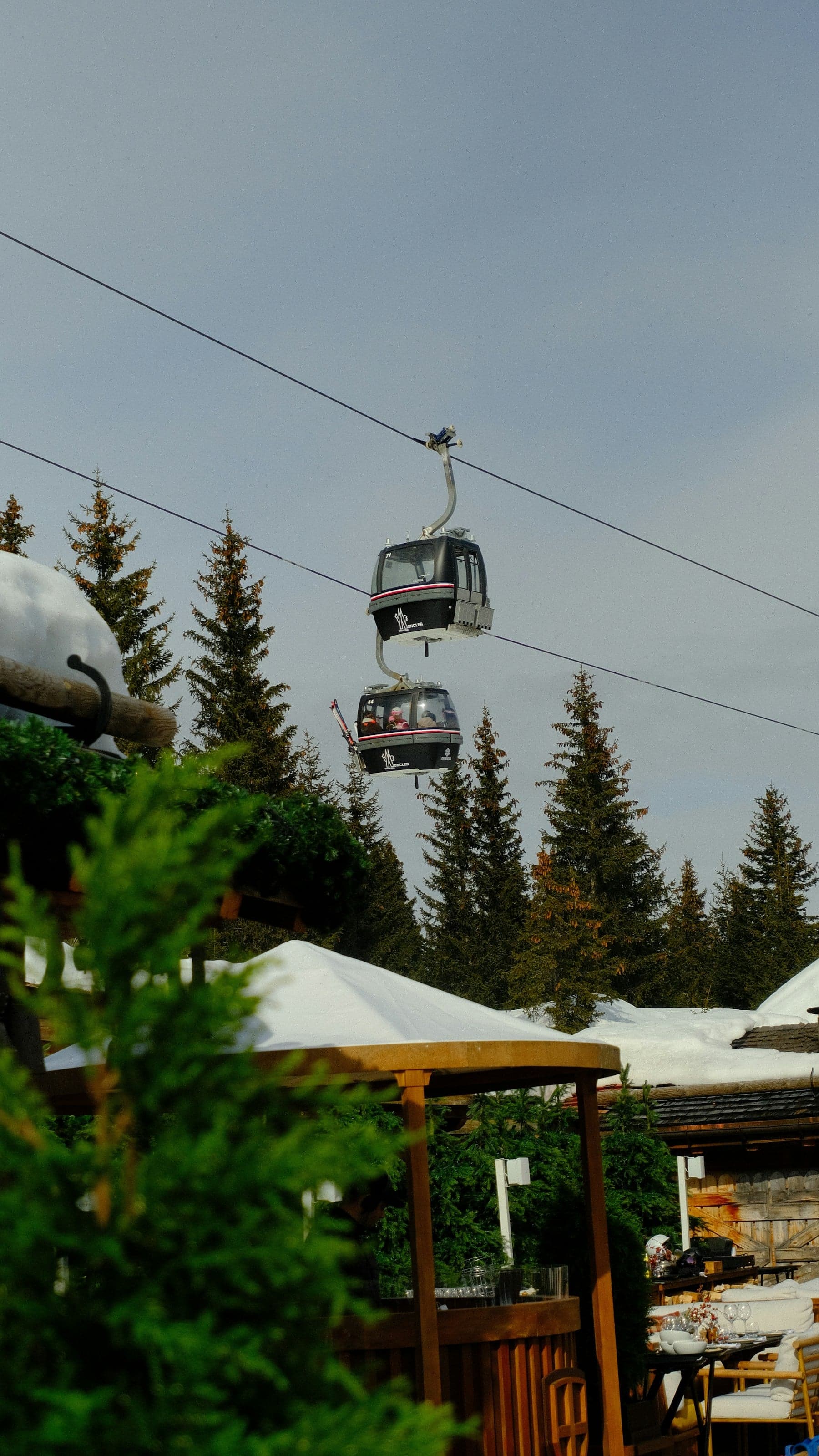 A ski lift over the snow-covered slopes of Courchevel