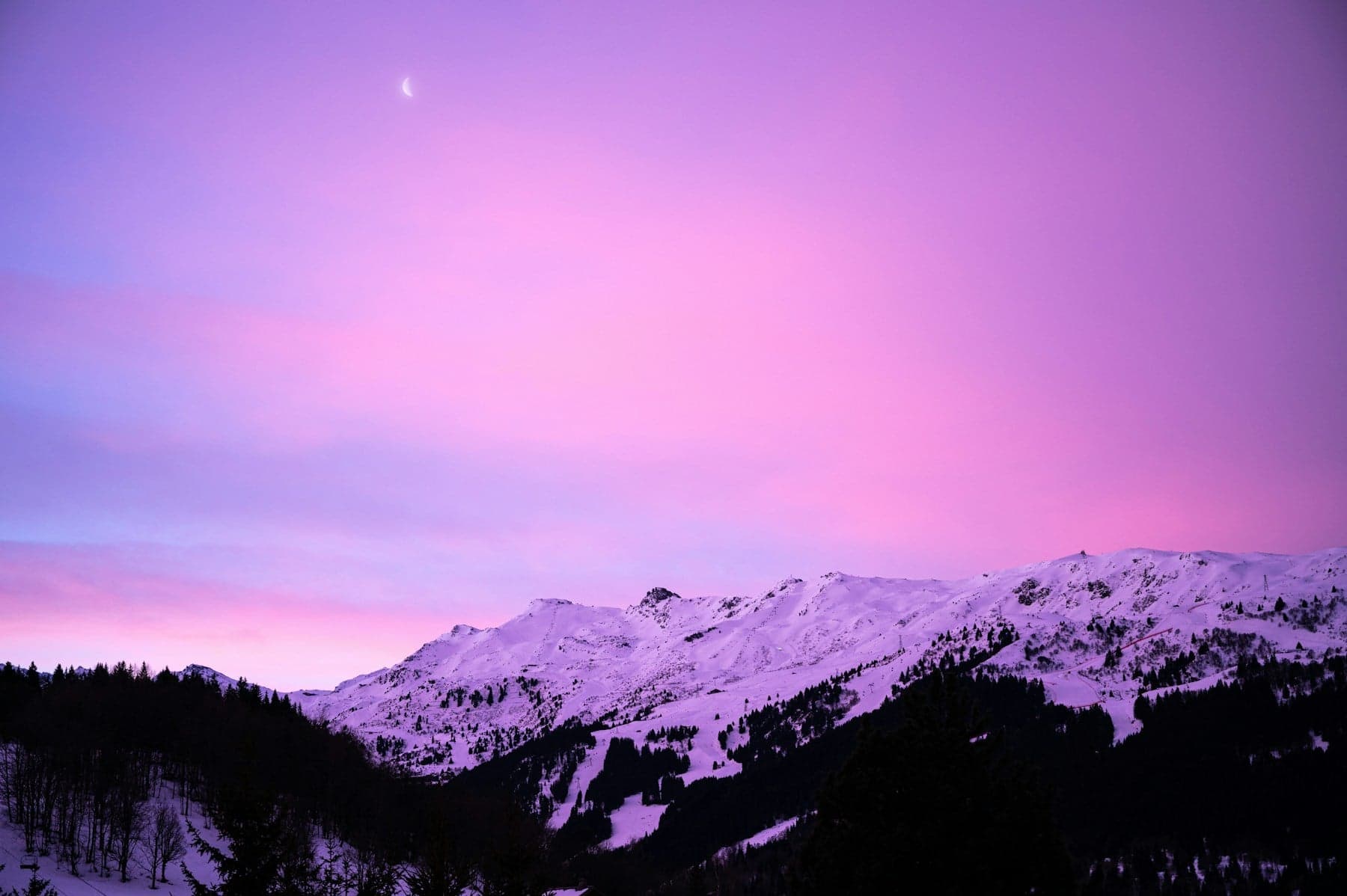 Snow-covered mountain above Méribel at dusk